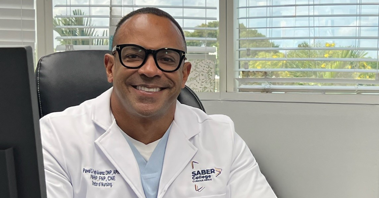 Dr. Pavel Pugh, Director of the Nursing Program at SABER College, smiling in a professional setting after his appointment to the NLN CNEA Board of Commissioners.